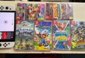 NINTENDO SWITCH OLED 64 Go AVEC 6 JEUX CARTOUCHES DE JEUX